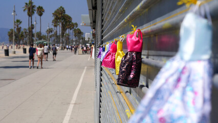 Obraz premium Close-up of a row of colorful doll dresses hung up on a line at Venice Beach in Los Angeles, California, USA