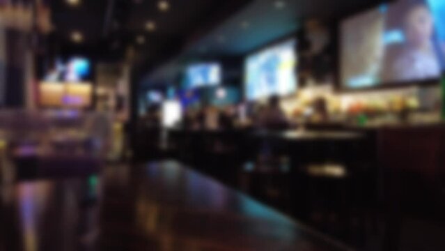 Blurred Wide Angle Table Shot Patrons Sports Fans Drinking Eating In Bar Pub Tavern