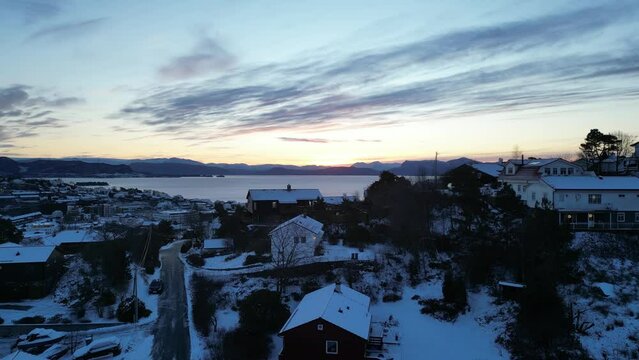 Sunrise over Bj&oslash;rnafjord and the harbor of Os&oslash;yro in Bj&oslash;rnafjorden municipality, Norway. Winter landscape.
