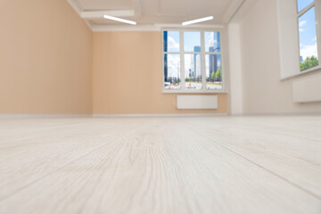 Fototapeta na wymiar New empty office room with clean windows and beige walls