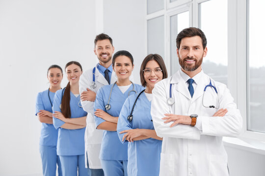 Team of professional doctors in clinic hallway