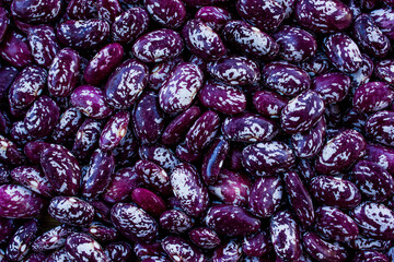 grains of red dry beans, background with legumes, healthy vegetarian food