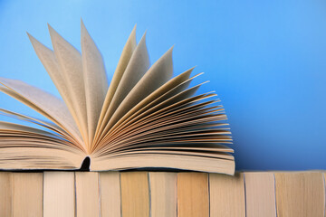 Collection of books on light blue background