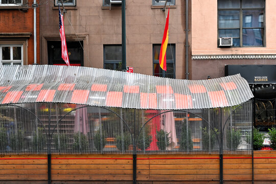 NEW YORK - 24 OCT 2022: Wize Gize Barbers and outdoor dining area in Manhattan.