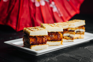 good sangwich with fried meat on a plate in the restaurant 