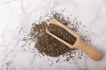 Chia in a wooden spoon close-up.Superfood. Healthy food. Diet. The concept of proper nutrition. antioxidant. Place for text, space for copy.