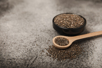 Bowl and spoon with chia seeds, closeup.Superfood. Healthy food. Diet. The concept of proper nutrition. antioxidant. Place for text, space for copy.