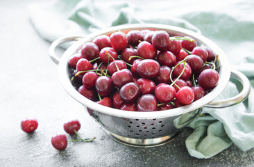 Fresh red cherries fruit in collander