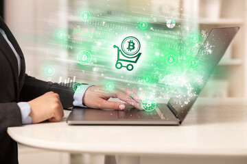 Young man watching stock market on laptop
