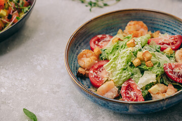 Caesar salad on a beautiful plate in a restaurant