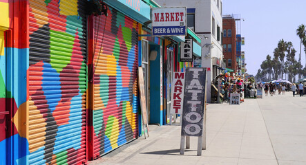  Closed storefront of a tattoo parlor on the boardwalk in Venice Beach, Los Angeles, California, USA - obrazy, fototapety, plakaty
