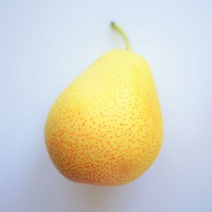 Yellow orange pear on a white sunny table