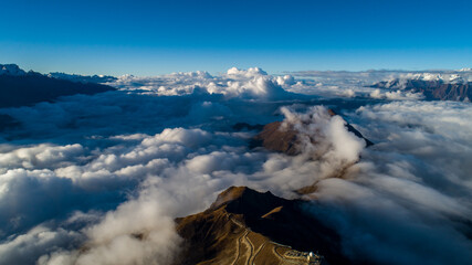 Clouds climb over the Himalayas, Tibet, China.