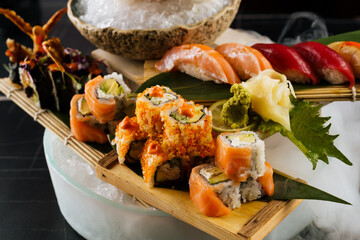 large set of sushi with good serving on ice