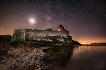 Night castle - stars and moon sky. Ukraine, Odessa region- Belgorod-Dniester fortress up to 1944 -...