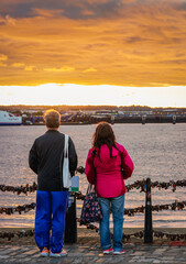 couple enjoying beautiful sunset in Liverpool, England
