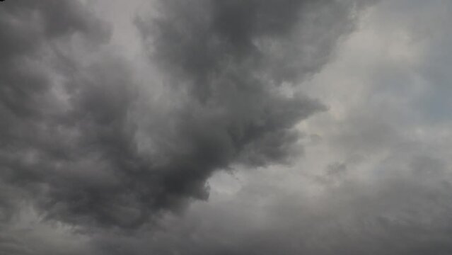 Dark grey cumulus clouds rolling before the storm 4K timelapse