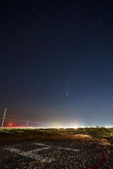 Real starry photo of Neowise comet C2020 F3 NEOWISE on moon rise. New moon crescent on horizon...