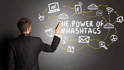 businessman drawing social media icons concept