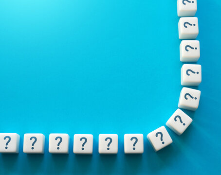 Blocks with question marks and copy space. Questions and problem solving. Frequently asked Questions FAQ. Interesting information and unknown facts. Explanations. Health and reproduction.