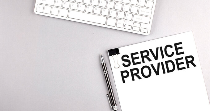 SERVICE PROVIDER text on paper with keyboard on grey background