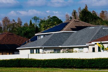 Fototapeta na wymiar Solar panel on a house roof; Green energy from sun 