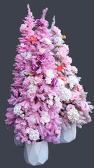Christmas Trees: mauve, pink and white made of flowers
