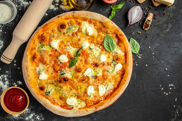 four cheese pizza, on a dark background, Fast food lunch, top view. place for text