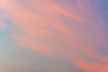 Look up view to the beautiful sky with pink coloured clouds at dawn. 