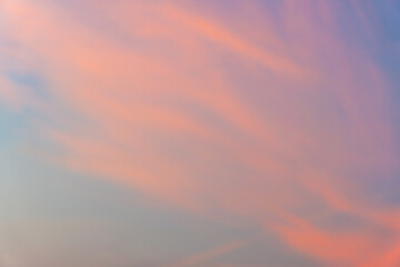 Look up view to the beautiful sky with pink coloured clouds at dawn. 