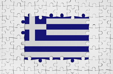 Greece flag in frame of white puzzle pieces with missing central parts