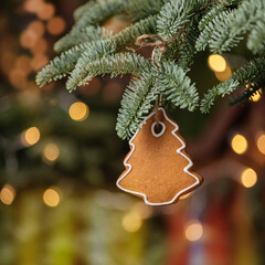 Christmas background with hanging christmas tree cookie
