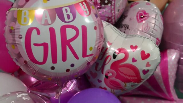 Pink balloons. The inscription on the balls "Girl". Children's birthday.