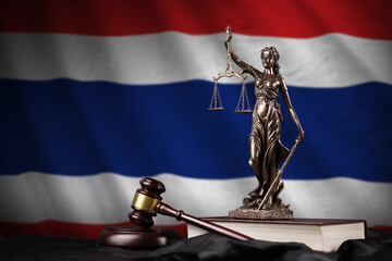 Thailand flag with statue of lady justice, constitution and judge hammer on black drapery. Concept of judgement and punishment - obrazy, fototapety, plakaty