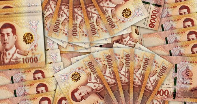 Thai Baht banknotes in a cash fan mosaic pattern loop. Thailand 1000 THB notes. Abstract concept of bank, finance, economy seamless and looped decorative design background. 