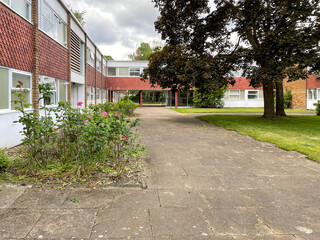 A courtyard at Parkleys, a post-war private low-rise Modernist housing estate in Ham, South-West London, near Richmond. Designed by Eric Lyons, built by SPAN Developments. 
