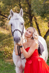 beautiful woman riding a white horse