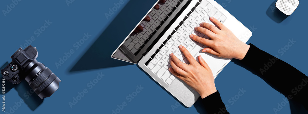 Poster laptop computer with a slr camera from above