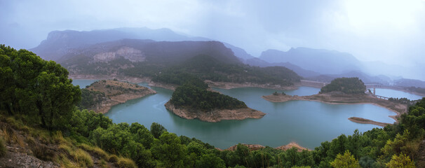 Fototapeta na wymiar Panoramic of a storm in a mountain dam (Ardales, Malaga, Spain)