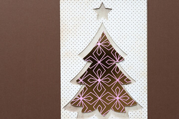 isolated paper tree with start on brown paper