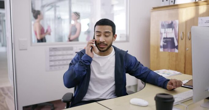 Young gym instructor on phone call talking to client about a membership fee, assisting with online application or answering faq. Fitness facilitator or administrator giving information on cellphone