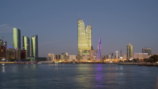 Day to Night 4K Time lapse of Bahrain Skyline and Bahrain Financial Harbour from Manama City, Bahrain