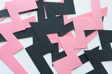 abstract background with cut black and pink paper zig zags (mostly)