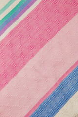 Closeup detail of multi color fabric texture samples.