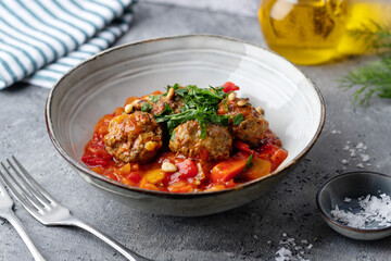 Meatballs with vegetables and tomato sauce