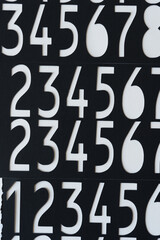 black paper with numbers cutout