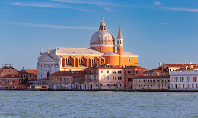 Fototapeta na wymiar View of the city waterfront church and the Grand Canal at sunset.