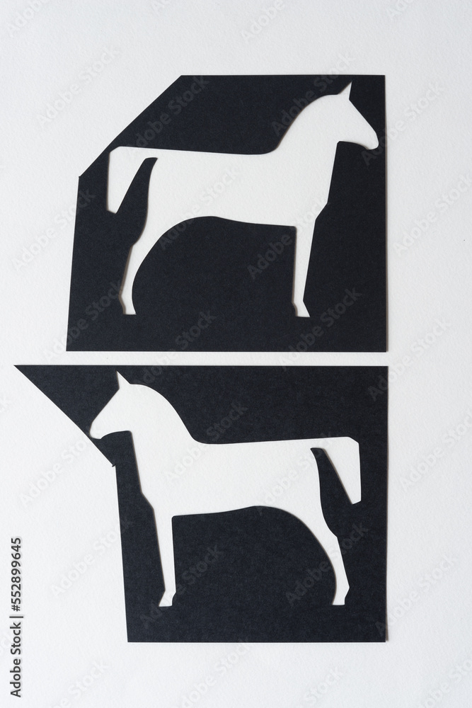 Wall mural stylized paper horses (glyph cutouts) on blank paper