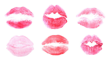 Set with lipstick kiss marks on white background, top view