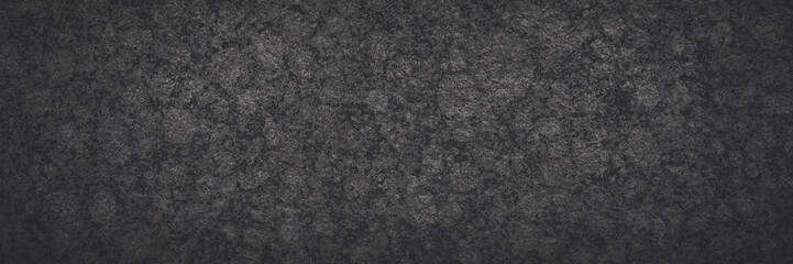 Dark gray granite texture. Natural granite with a grainy pattern. Solid rough surface of rock with...